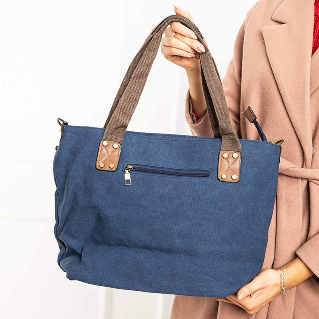 Blauwe tas met lange en korte schouderriemen, draagbaar op 2 manieren