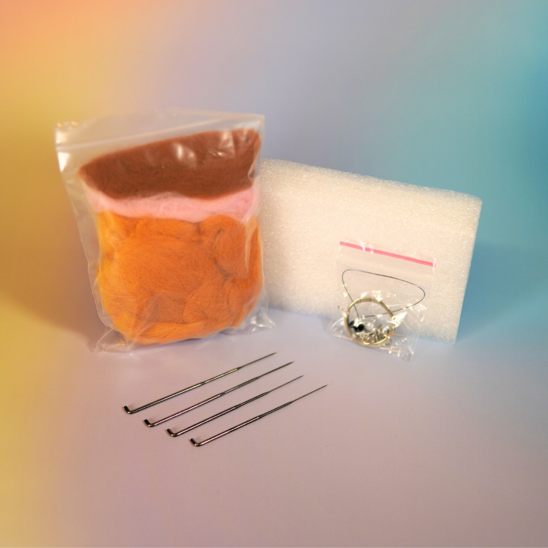 DIY set met materialen voor een oranje kat van naaldvilt vilt dieren maken