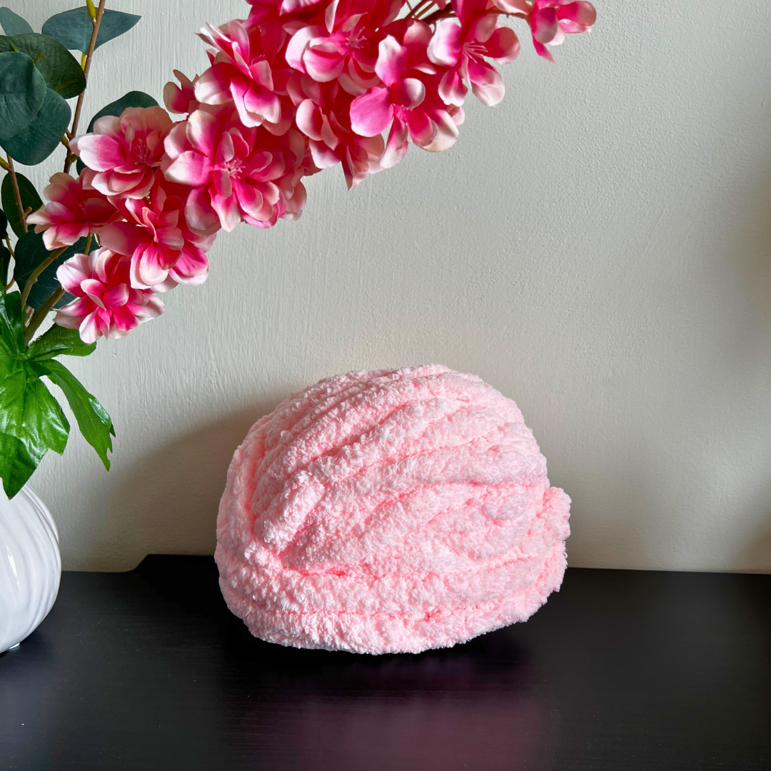 deken maken met roze chunky yarn